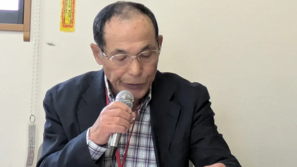予算と決算の報告をする武富副会長兼会計